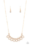 A white rhinestone encrusted gold ribbon delicately loops below the collar, coalescing into a timelessly stationary statement piece. Features an adjustable clasp closure.  Sold as one individual necklace. Includes one pair of matching earrings.