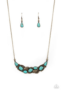 A collection of asymmetrical turquoise stones adorns the front of a studded brass frame embossed in floral and feathery accents below the collar, creating a seasonal centerpiece. Features an adjustable clasp closure.  Sold as one individual necklace. Includes one pair of matching earrings.   Get The Complete Look! Bracelet: "Cottage Living - Brass" (Sold Separately)