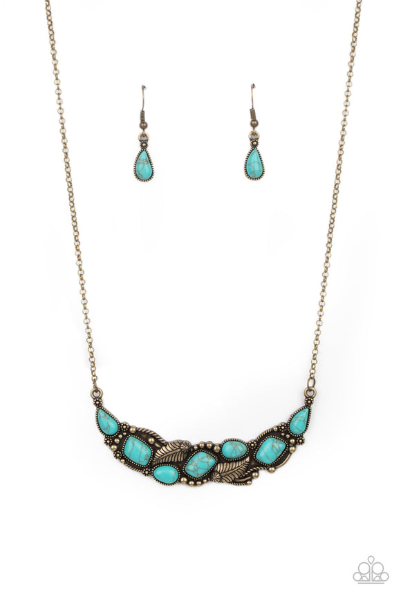 A collection of asymmetrical turquoise stones adorns the front of a studded brass frame embossed in floral and feathery accents below the collar, creating a seasonal centerpiece. Features an adjustable clasp closure.  Sold as one individual necklace. Includes one pair of matching earrings.   Get The Complete Look! Bracelet: 