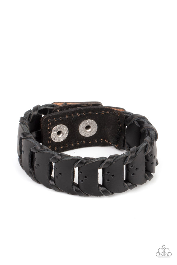 Black leather laces loop around interconnected leather links, creating a rustic display around the wrist. Features an adjustable snap closure.  Sold as one individual bracelet.