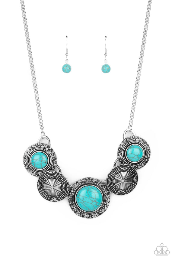Embossed in swirly patterns, blue turquoise stone frames link with antiqued silver frames radiating with spiral textures below the collar for a seasonal inspired flair. Features an adjustable clasp closure.  Sold as one individual necklace. Includes one pair of matching earrings.