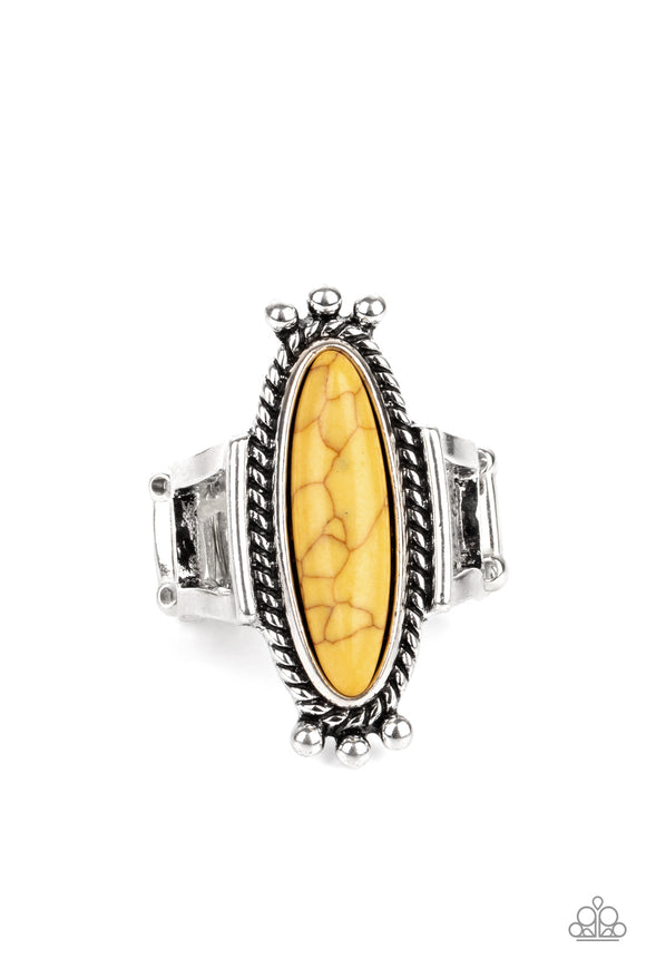 An oblong yellow stone is pressed into the center of a rustic silver frame radiating with studded and metallic ropelike textures, creating a seasonal centerpiece atop the finger. Features a stretchy band for a flexible fit.  Sold as one individual ring.