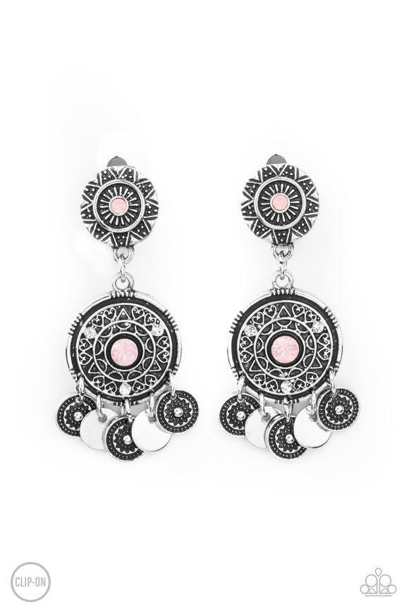 Dainty silver discs and antiqued floral frames dance from the bottom of an ornately embossed silver frame that links to a matching silver fitting. Both frames are dotted in pink opalescent rhinestone centers, while the largest of frames is sprinkled in dainty white rhinestone accents for a dreamy finish. Earring attaches to a standard clip-on fitting.  Sold as one pair of clip-on earrings.