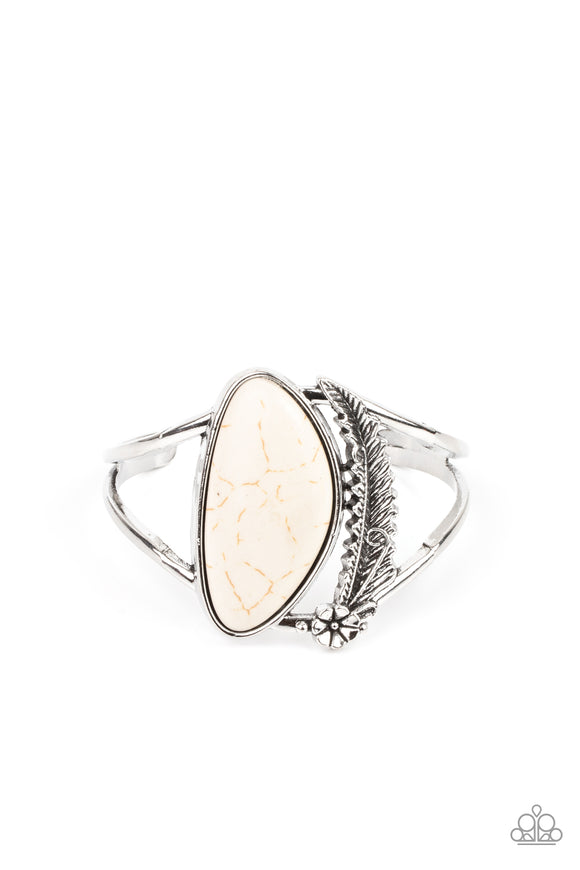 Dotted with a dainty silver flower, a lifelike silver feather charm curves around an asymmetrical white stone centerpiece atop an airy silver cuff.  Sold as one individual bracelet.