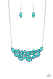 Encased in sleek silver frames, a collection of marquise shaped blue beads delicately coalesce into a leafy pendant below the collar for a whimsical pop of color. Features an adjustable clasp closure.  Sold as one individual necklace. Includes one pair of matching earrings.