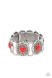 Dotted in ornate silver studs, red stone embellished silver frames join hammered silver plates along stretchy bands around the wrist for a colorful seasonal flair.  Sold as one individual bracelet.