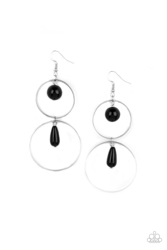 A classic black bead swings from the top of a shiny silver hoop that is linked to another silver hoop by a matching black bead, creating a stunningly stacked display. Earring attaches to a standard fishhook fitting.  Sold as one pair of earrings.