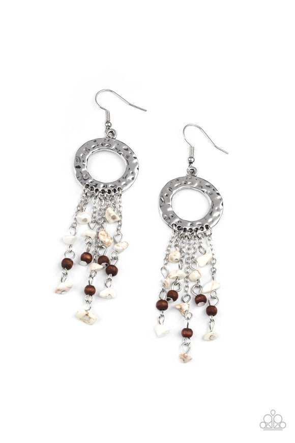 Tapered tassels of dainty wooden beads and white pebbles stream from the bottom of a hammered silver hoop, creating an earthy fringe. Earring attaches to a standard fishhook fitting.  Sold as one pair of earrings.