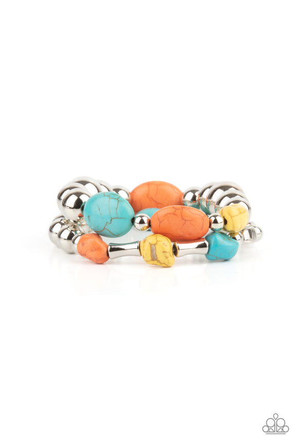 Mismatched turquoise, orange, and yellow stones and oversized silver beads are threaded along stretchy bands around the wrist, creating earthy layers.  Sold as one pair of bracelets.