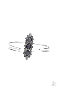 Infused with glassy purple stone centers, silver flowery frames stack across the center of an airy silver cuff for an enchanted fashion.  Sold as one individual bracelet.