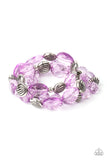 A mismatched collection of sparkly purple crystal-like beads and textured silver accents are threaded along stretchy bands around the wrist, creating glamorous layers.  Sold as one set of three bracelets.