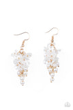 A cluster of pearly white floral frames and dainty white pearls trickle from a gold chain, creating a romantic chandelier. Earring attaches to a standard fishhook fitting.  Sold as one pair of earrings.