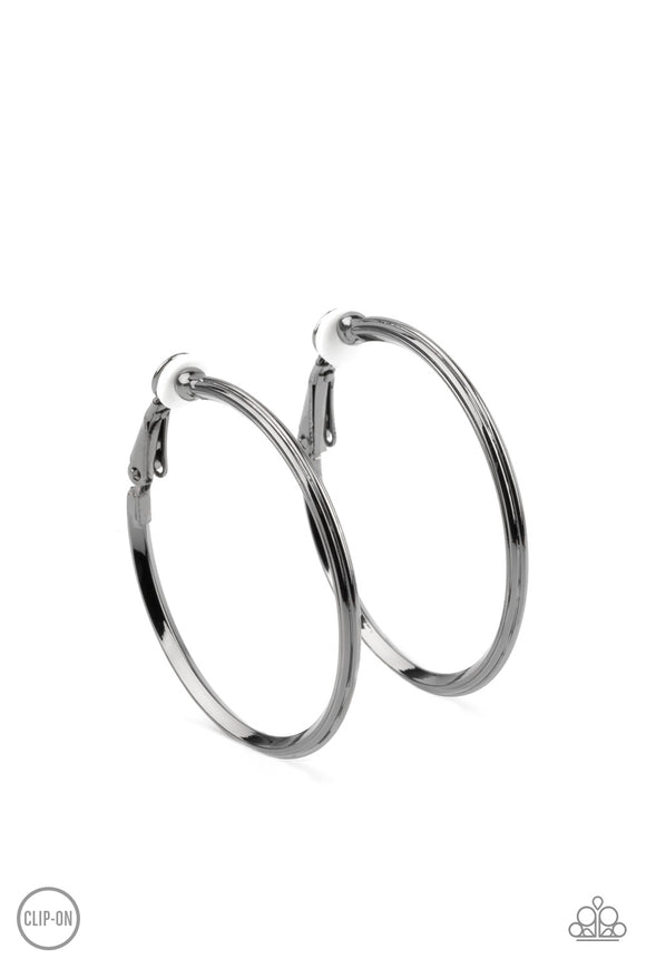 Etched in fine lines, a beveled gunmetal hoop curls around the ear for a classic look. Hoop measures approximately 1 1/2