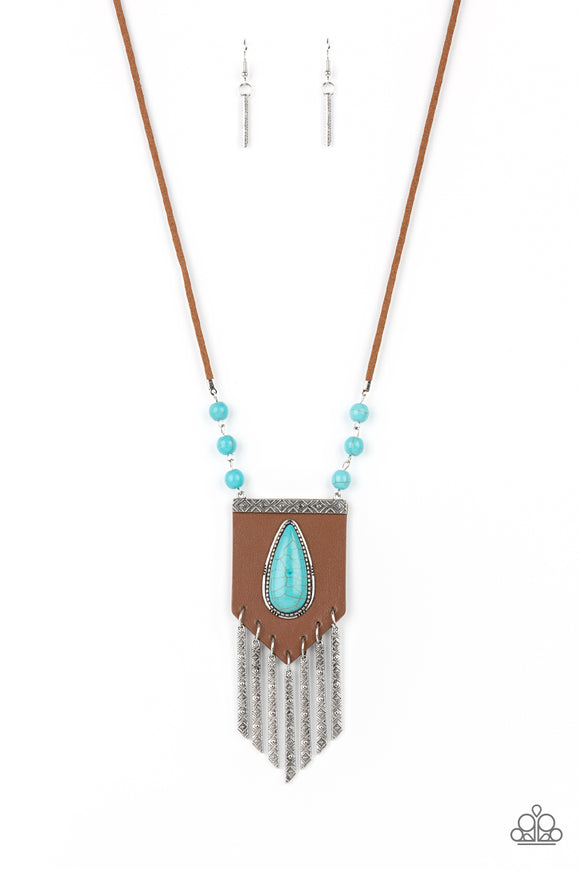 A bold blue teardrop stone encased in an antiqued silver frame is centered on a brown leather insignia-like pendant. Decorated with a silver plate embossed in geometric designs and a tinkling fringe of embossed silver plates suspended from the bottom, the pendant sways from lengthened leather cords accented with turquoise stone beads for an enchantingly timeless finish. Features an adjustable clasp closure.  Sold as one individual necklace. Includes one pair of matching earrings.