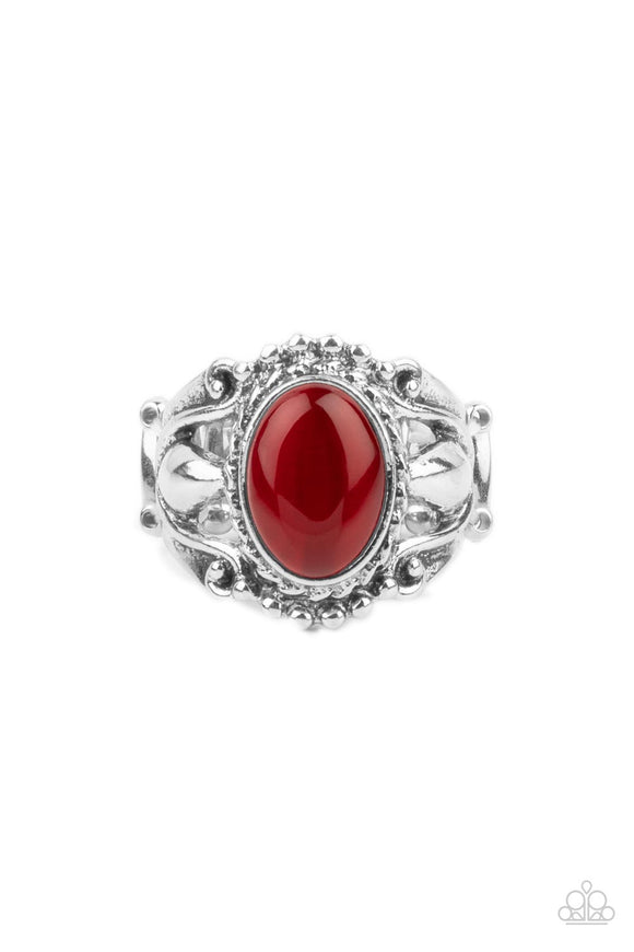 A polished red cat's eye stone creates a jubilant statement as it rests inside a studded silver frame atop an airy pedestal like band. Features a stretchy band for a flexible fit.  Sold as one individual ring.
