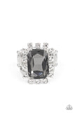 Featuring dainty silver square fittings, an explosion of glassy white rhinestones fans out from a dramatically oversized emerald cut smoky rhinestone center, creating a stellar centerpiece atop the finger. Features a stretchy band for a flexible fit.  Sold as one individual ring.