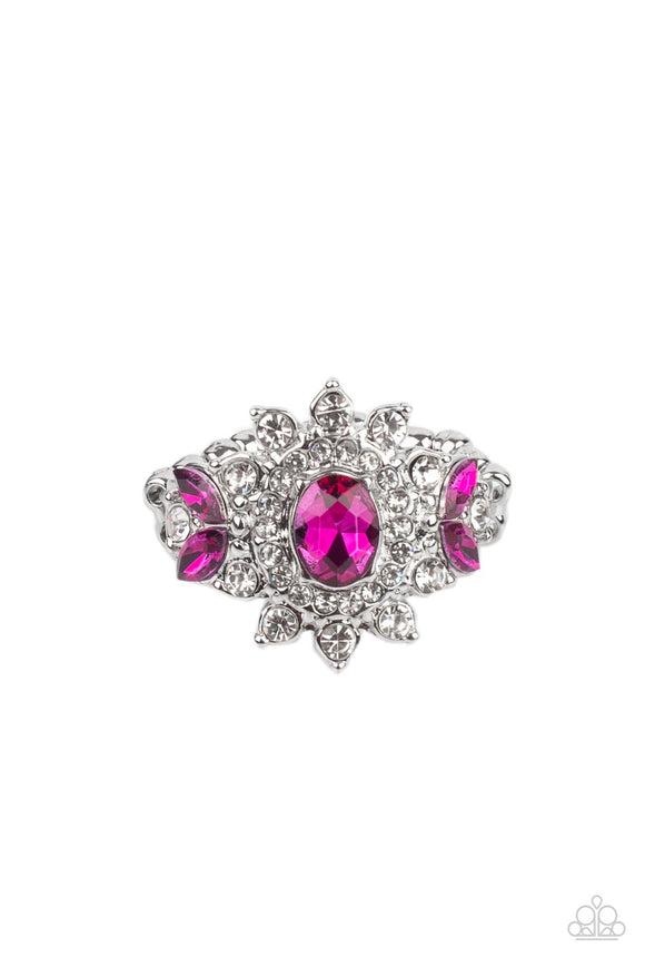 Glassy white rhinestone petals flare out from an oval pink rhinestone center. Dainty pink marquise rhinestones embellish the sides of the glittery frame, adding regal leafy accents. Features a stretchy band for a flexible fit.  Sold as one individual ring.