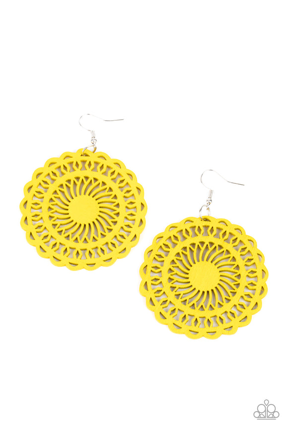 Painted in a sunny yellow finish, a stenciled wooden frame is cutout into a radiating sunburst frame for a colorfully tropic look. Earring attaches to a standard fishhook fitting.  Sold as one pair of earrings.