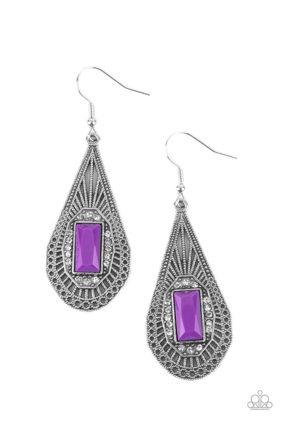 A bright purple baguette-cut bead, bordered with sparkling white rhinestones, sits center stage inside a teardrop frame. Delicate art deco filigree fills the frame creating a richly embellished lure. Earring attaches to a standard fishhook fitting.  Sold as one pair of earrings.