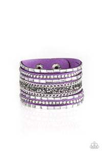 White emerald-cut rhinestones, smoky round rhinestones, and metallic prism-shaped rhinestones are sprinkled along strands of vivacious purple suede. Shimmery silver chain is added to the mix for a sassy industrial finish. Features an adjustable snap closure.  Sold as one individual bracelet.