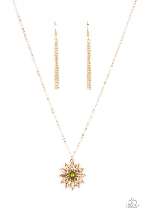 Golden champagne marquise cut rhinestones fan out from an oval green rhinestone center, creating a fabulous floral pendant at the bottom of a dainty gold chain. Features an adjustable clasp closure.  Sold as one individual necklace. Includes one pair of matching earrings.