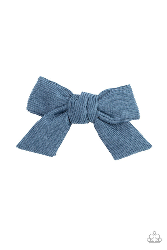 A Spring Lake corduroy ribbon delicately knots into a dainty bow, creating a rustic centerpiece. Features a standard hair clip on the back.  Sold as one individual hair clip.