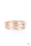 Featuring a polished finish, a mismatched collection of textured, braided, hammered, and plain rose gold bangles stack across the wrist for a classic metallic look.  Sold as one set of seven bracelets.