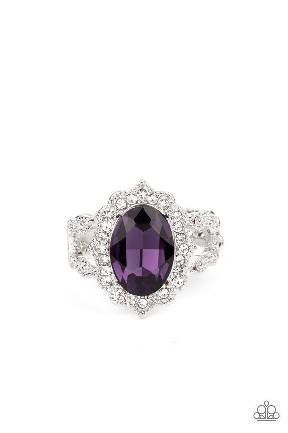 Dotted in dainty white rhinestones, a scalloped silver frame gathers around an oversized purple gem atop ornately studded silver bands for a glitzy look. Features a dainty stretchy band for a flexible fit.  Sold as one individual ring.