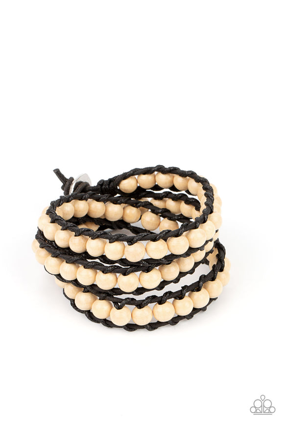 A row of white wooden beads are knotted in place along two black leather cords, creating multiple earthy layers around the wrist with its extended length. Features an adjustable button loop closure.  Sold as one individual bracelet.