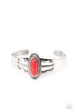 An oval red bead is pressed into the center of a textured silver frame atop a layered silver cuff stamped in swirly texture, resulting in a trendy pop of color around the wrist.  Sold as one individual bracelet.