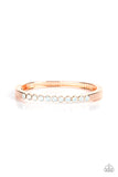 An opalescent row of white rhinestones hinges to a glistening rose gold bar that curves around the wrist, creating a sparkly cuff-like bracelet. Features a hinged closure.  Sold as one individual bracelet.