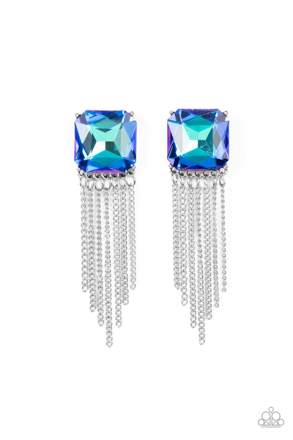 Featuring a stellar UV shimmer, an oversized radiant cut blue gem is pressed into a pronged silver fitting that gives way to a tapered curtain of silver chains for an out-of-this-world finish. Earring attaches to a standard post fitting.  Sold as one pair of post earrings.