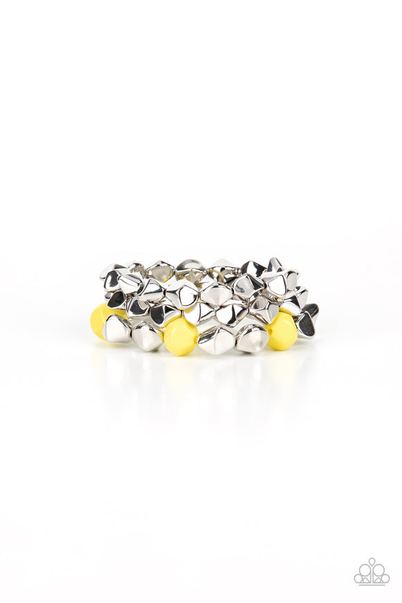 Infused with pops of Illuminating accents, a faceted series of silver beads are threaded along stretchy bands around the wrist for a flashy fashion.  Sold as one set of three bracelets.