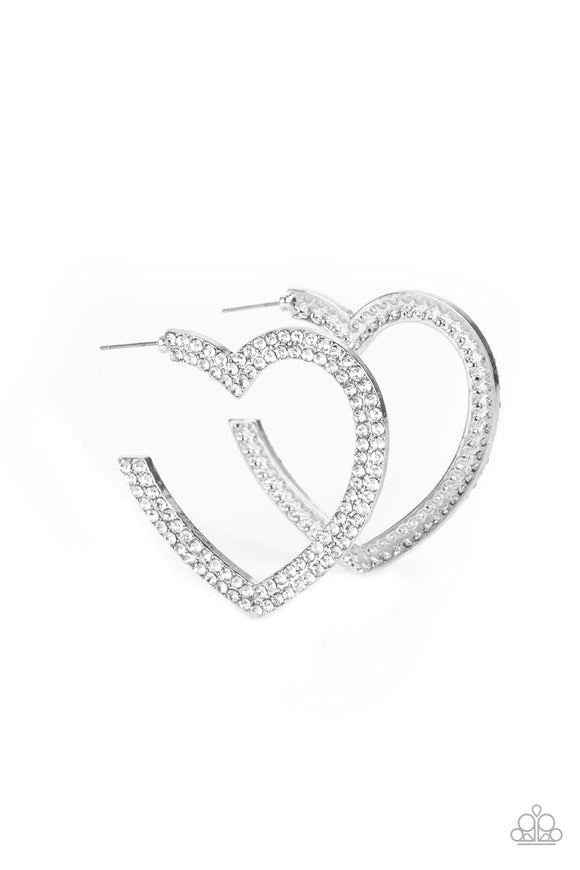 Two rows of blinding white rhinestones are encrusted along the front of a heart shaped silver hoop, creating a heart-stopping sparkle. Hoop measures approximately 2