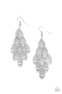 Featuring abstract crisscrossed texture, oval silver frames cascade from a metallic netted backdrop, resulting in a noise-making lure. Earring attaches to a standard fishhook fitting.  Sold as one pair of earrings.