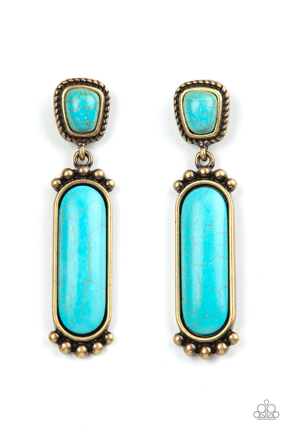 Bordered in a brass rope-like frame, an asymmetrical turquoise stone links with an oversized oval turquoise stone encased in a pronged brass frame for an authentic southwestern inspired style. Earring attaches to a standard post fitting.  Sold as one pair of post earrings.