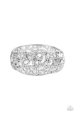 Shiny silver vine-like filigree enchantingly twines across the centers of two airy silver frames that delicately hinged into a bangle-like bracelet, resulting in a regal centerpiece. Features a hinged closure.  Sold as one individual bracelet.