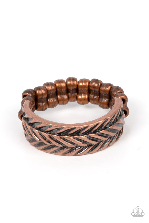Etched in rustic patterns, slanted rows of chevron-like textures alternate across a dainty copper band. The centermost row is raised, adding 3-dimensional detail to the rustic centerpiece. Features a dainty stretchy band for a flexible fit.  Sold as one individual ring.
