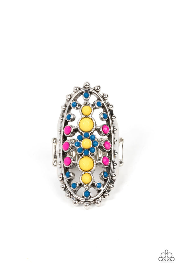 Dainty Illuminating, Mykonos Blue, and Fuchsia Fedora beads dot the airy front of a studded silver oval frame, creating a colorful floral pattern across the finger. Features a stretchy band for a flexible fit.  Sold as one individual ring