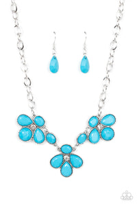 Encased in textured silver fittings, oversized oval and teardrop blue beads delicately gather around glassy white rhinestone centers for a colorful floral look below the collar. Features an adjustable clasp closure.  Sold as one individual necklace. Includes one pair of matching earrings.