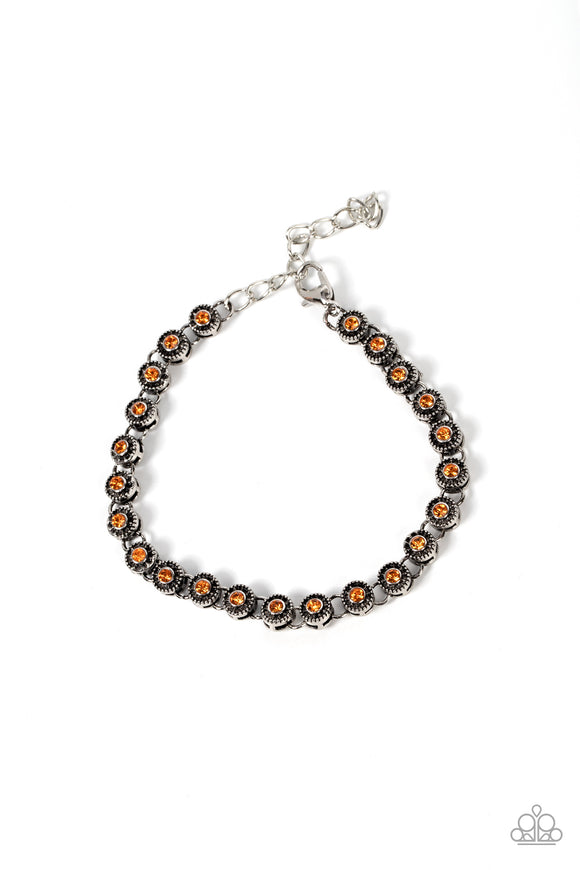 Featuring studded silver fittings, a dainty collection of orange rhinestones delicately connects with antiqued silver links for a subtle shimmer around the wrist. Features an adjustable clasp closure.   Featured inside The Preview at GLOW! Sold as one individual bracelet.