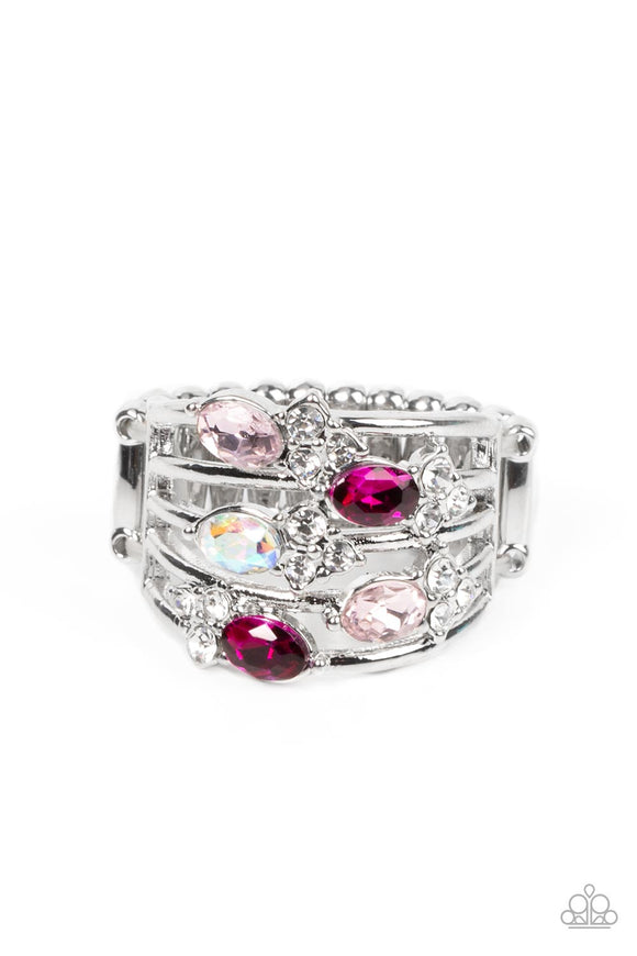 Infused with clusters of dainty white rhinestones, a glitzy collection of Pale Rosette, Fuchsia Fedora, and iridescent rhinestones are sprinkled across layers of silver bands, creating an ethereal sparkle across the finger. Features a dainty stretchy band for a flexible fit.  Sold as one individual ring.