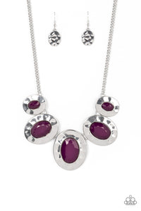 Gradually increasing in size, hammered silver oval frames are dotted with faceted plum beads as they delicately link below the collar for a vivacious pop of color. Features an adjustable clasp closure.  Sold as one individual necklace. Includes one pair of matching earrings.