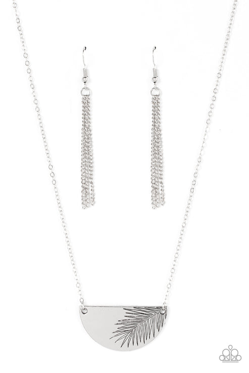 Suspended between the center of a dainty silver chain, a glistening silver half moon plate is stamped in an antiqued palm leaf for a seasonal flair. Features an adjustable clasp closure.  Sold as one individual choker necklace. Includes one pair of matching earrings.