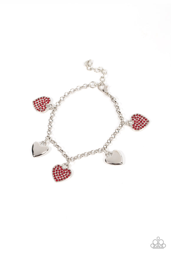 Shiny silver heart charms delicately alternate with red rhinestone encrusted heart frames along a silver chain around the wrist, resulting in a flirtatious fringe. Features an adjustable clasp closure.  Sold as one individual bracelet.