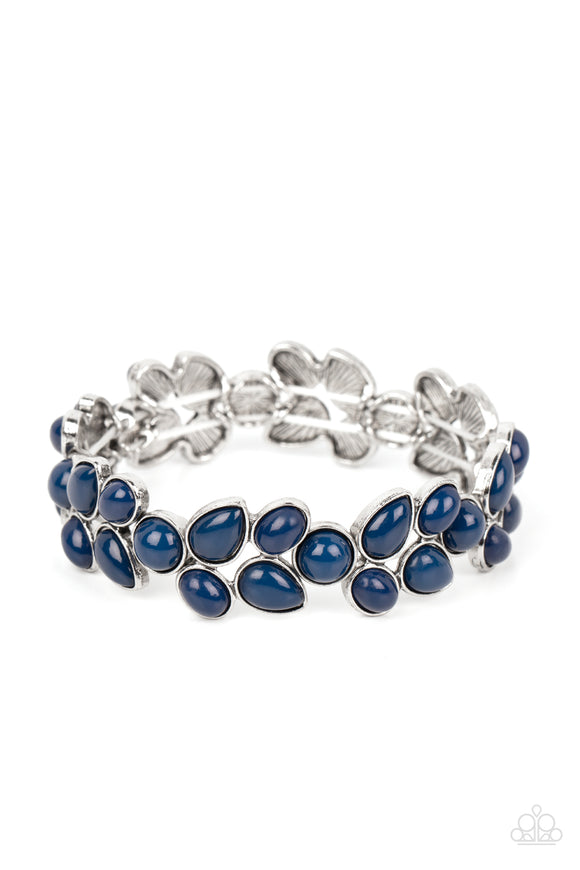 A flourishing collection of blue oval, round, and teardrop beads coalesce into abstract floral-inspired frames. The enchanting frames, threaded along stretchy bands, add a refreshing pop of color around the wrist.  Sold as one individual bracelet.