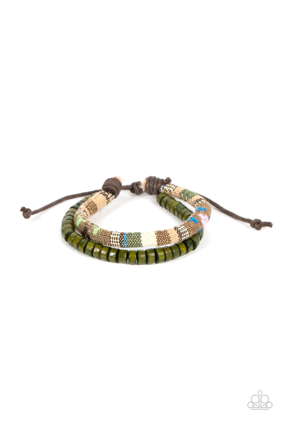 A strand of green wooden beads joins a colorful textile banded cord around the wrist, layering into a versatile and seasonal centerpiece around the wrist. Features an adjustable sliding knot closure.  Sold as one individual bracelet.