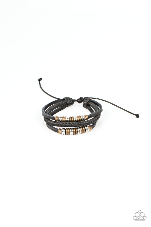 Infused with sections of smooth and textured brass and silver rings, a pair of black leather bands joins a strand of spun black cording around the wrist, resulting in rustic layers. Features an adjustable sliding knot closure.   Featured inside The Preview at GLOW! Sold as one individual bracelet.