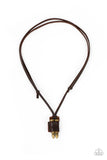 A piece of brown leather wraps around a pair of brass bullets, creating an edgy urban pendant at the bottom of knotted strands of brown leather. Features an adjustable sliding knot closure.  Sold as one individual necklace.