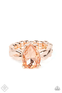 A luxurious peach teardrop gem sits regally atop a twisted rose gold band, creating a stunning centerpiece atop the finger. Features a dainty stretchy band for a flexible fit.  Sold as one individual ring.